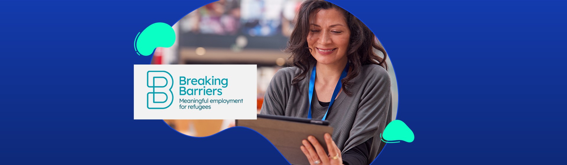 A woman smiles while looking at a tablet. The Breaking Barriers logo and tagline "Meaningful employment for refugees" appear beside her on a blue background.