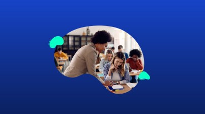 A teacher assists a smiling student with schoolwork in a classroom. Other students are focused on their tasks in the background. The image is set against a blue abstract shape.