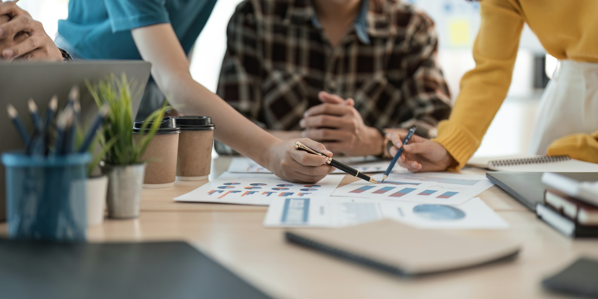 Group of young asian creative business brainstorm meeting presentation, discussing roadmap to