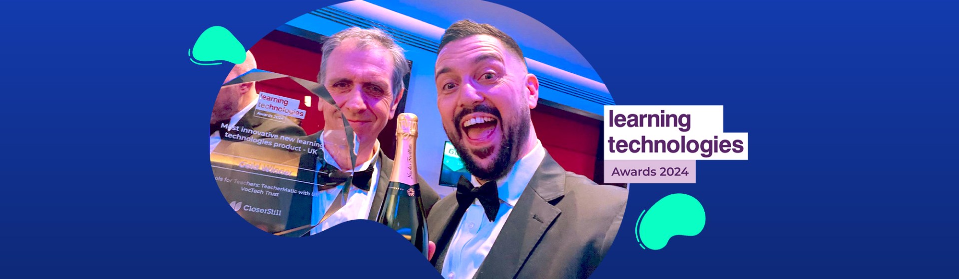 Two men in tuxedos, smiling and holding a trophy and champagne, stand before a "Learning Technologies Awards 2024" sign on a blue abstract background, celebrating innovations like TeacherMatic's role in transforming vocational education through the Blended Learning Consortium.
