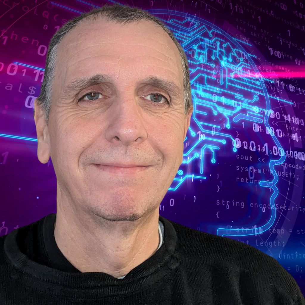 A smiling man staring at camera