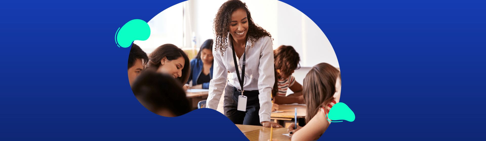 A teacher stands and interacts with seated students in a classroom, all appearing engaged in discussion or study, against a blue abstract background.
