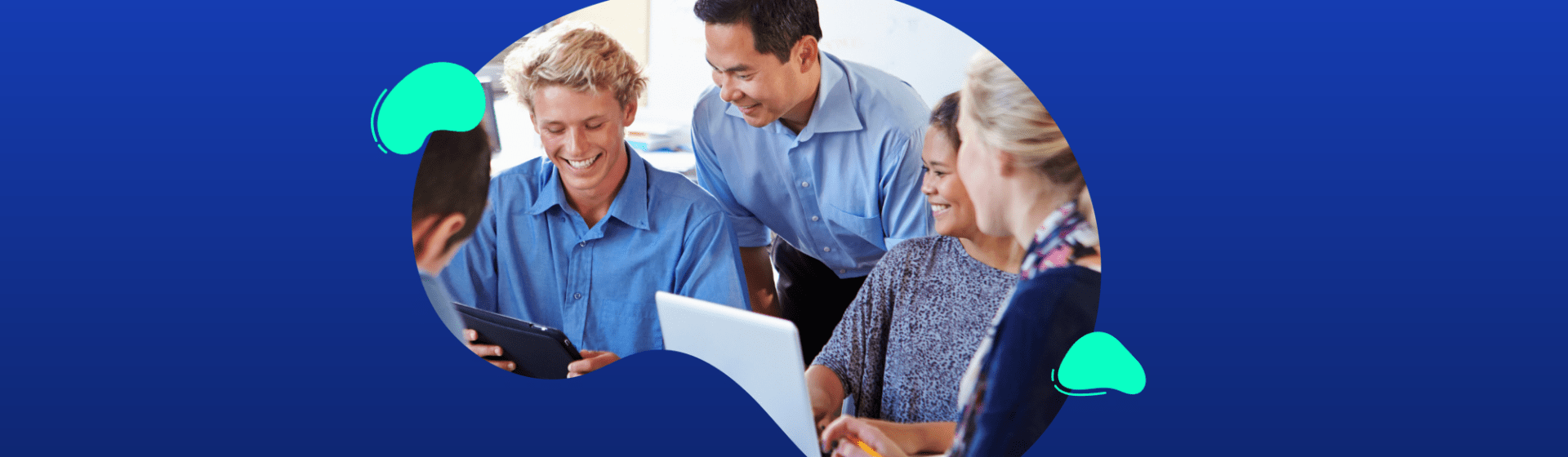 Four people sit and stand around a table, looking at a tablet and smiling, with a blue background and abstract shapes framing the photo.